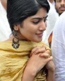 Megha Akash in gold color dress